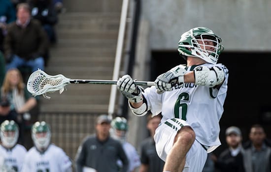 A Loyola Lacrosse player throws the ball during the game
